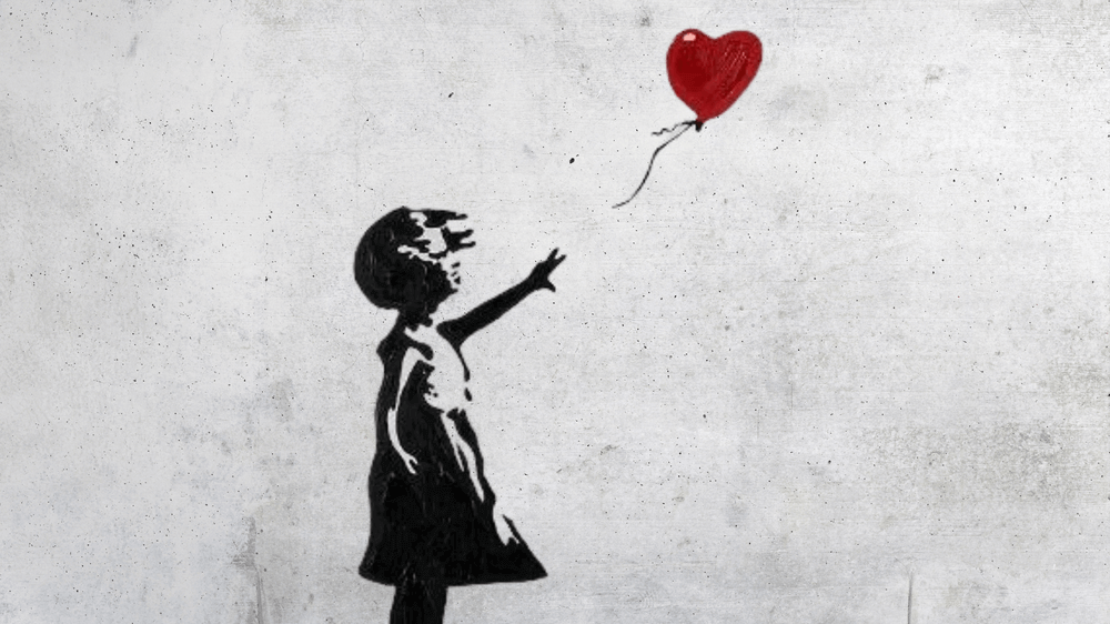 Chica grafitera con globo de Banksy