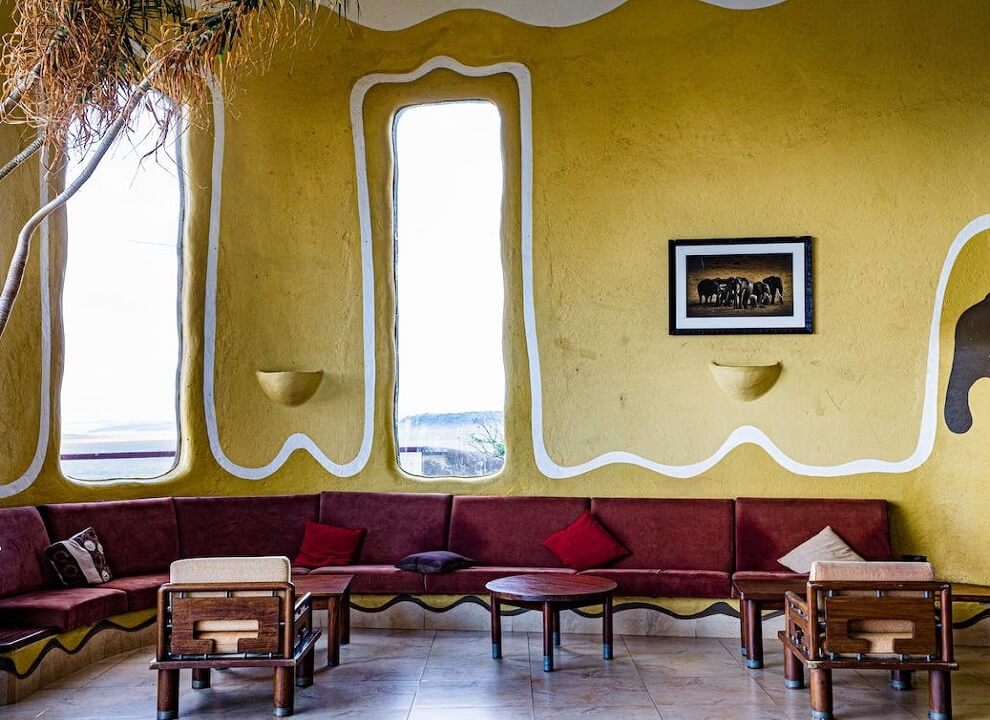 adding-depth-with-texture-in-color-yellow-wall-and-red-sofa-living-space