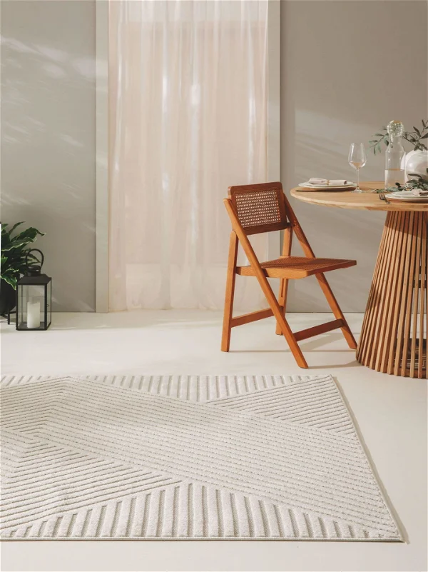 Scandinavian dining area with white textured carpet.