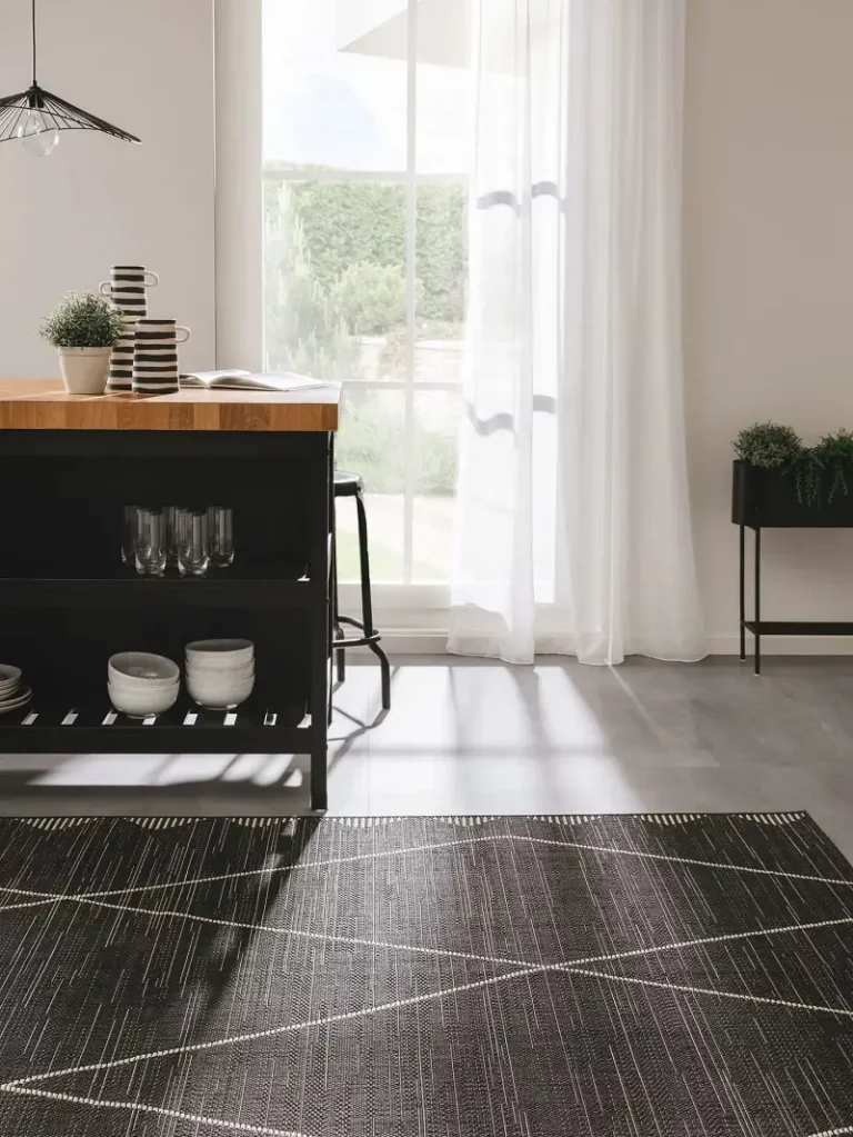 An indoor carpet in a color of black with a line diagonal line design