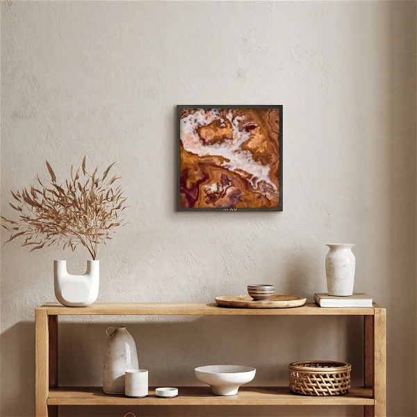 A marble wall art painting in color brown and beige hanged on the wall.