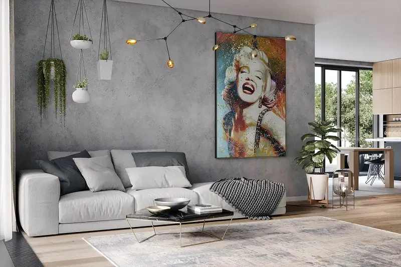 A living room with a large painting of a woman