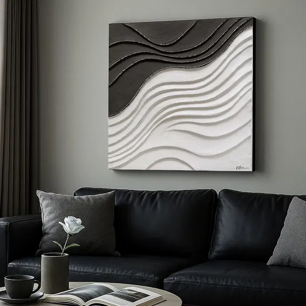 A textured minimalist painting in black and white displayed in a living room with a leather couch and coffee table.