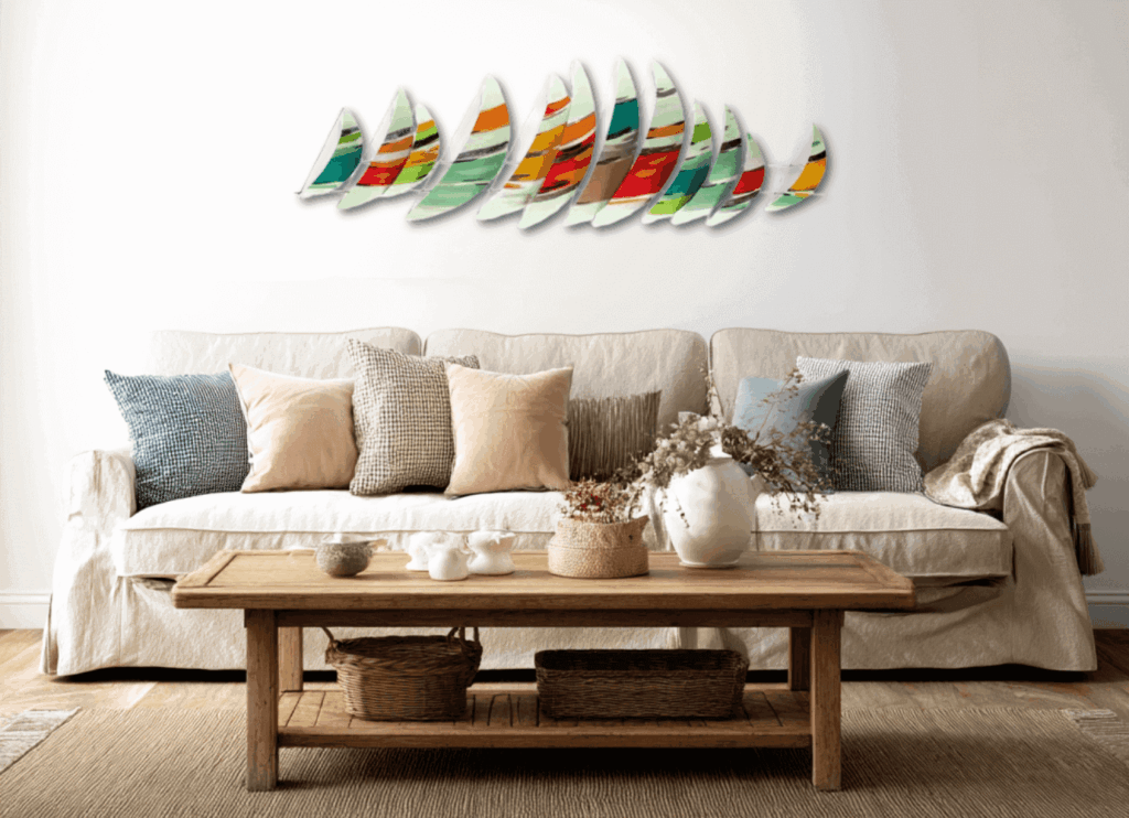 Metal wall art and a couch with neautral color throw pillows