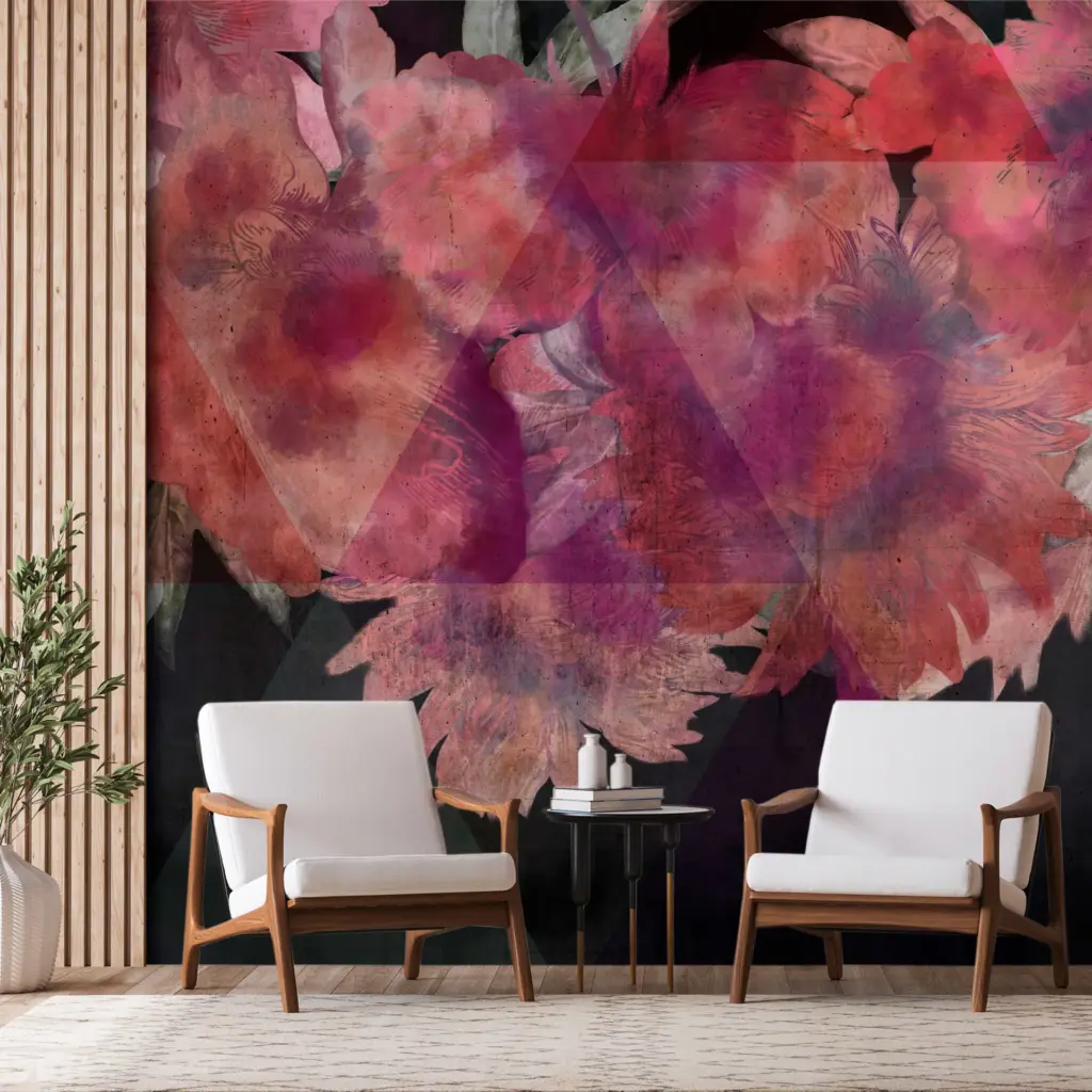 A room interior showing a large-scale wall mural of oversized, dreamy pink and purple floral blooms behind two modern wood-frame armchairs.